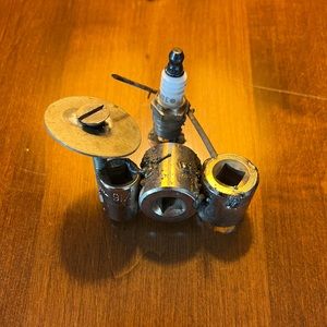 Metal spark plug action figure.